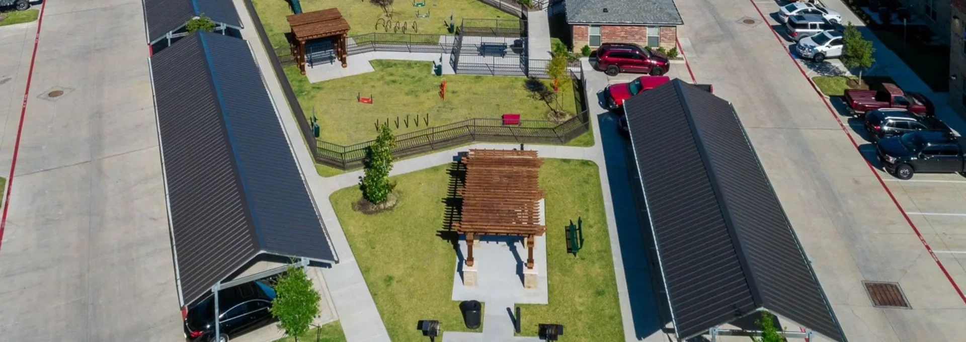 an aerial view of a parking lot with a car in it at The Auberge of Burleson