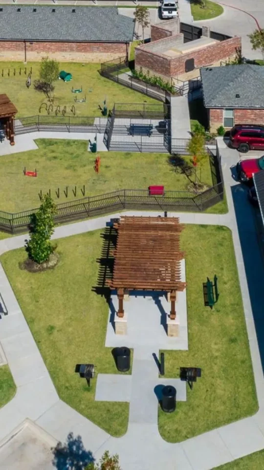 an aerial view of a parking lot with a car in it at The Auberge of Burleson